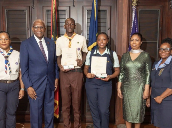 Two recipients accept the Halo Foundation Guiding Light Award for uniformed bodies