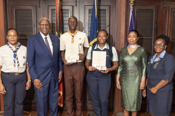 Two recipients accept the Halo Foundation Guiding Light Award for uniformed bodies